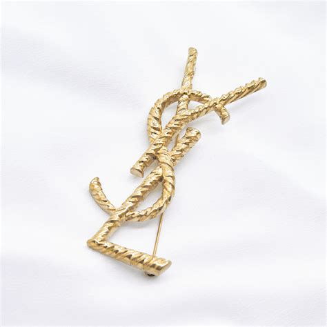 ysl opyum brooch|Saint Laurent Opyum YSL gewundene Brosche.